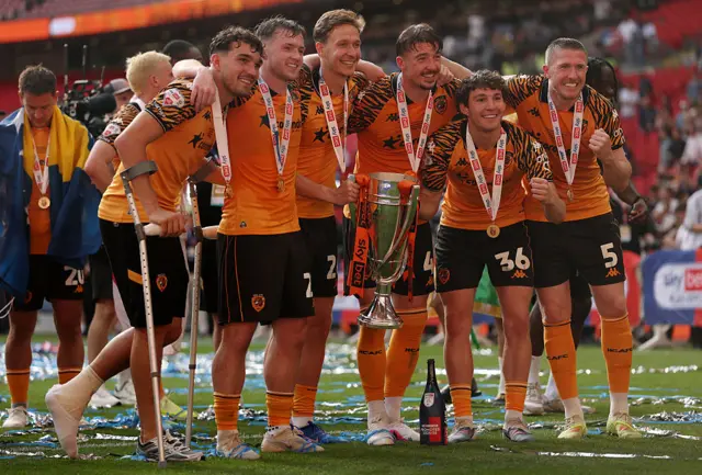 Hull City players celebrate with the Championship Play-off Trophy