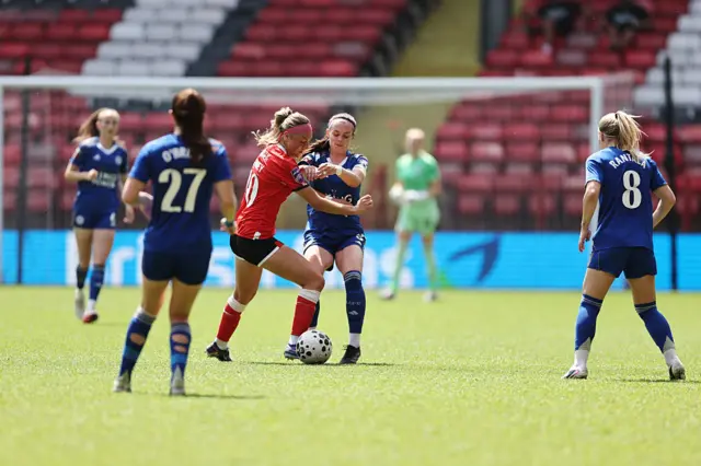 Players tussle for the ball