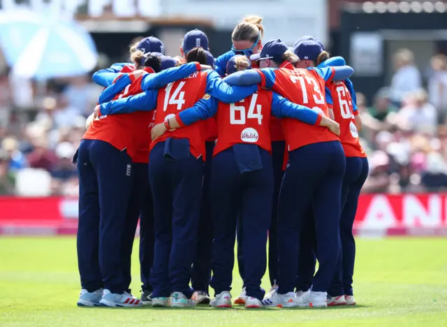 England players huddle before the match