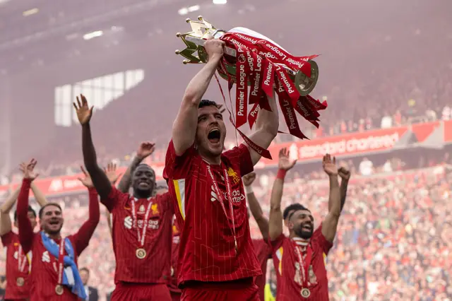 Andy Robertson lifting the Premier League trophy for Liverpool
