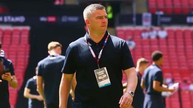 Bolton boss Steven Schumacher on the pitch at Wembley before kick-off