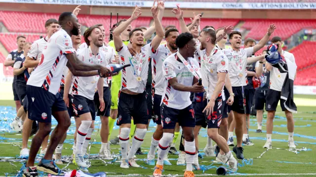 Bolton players celebrate on the pitch