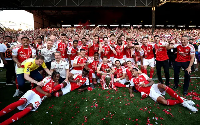 Arsenal players with the Premier League trophy
