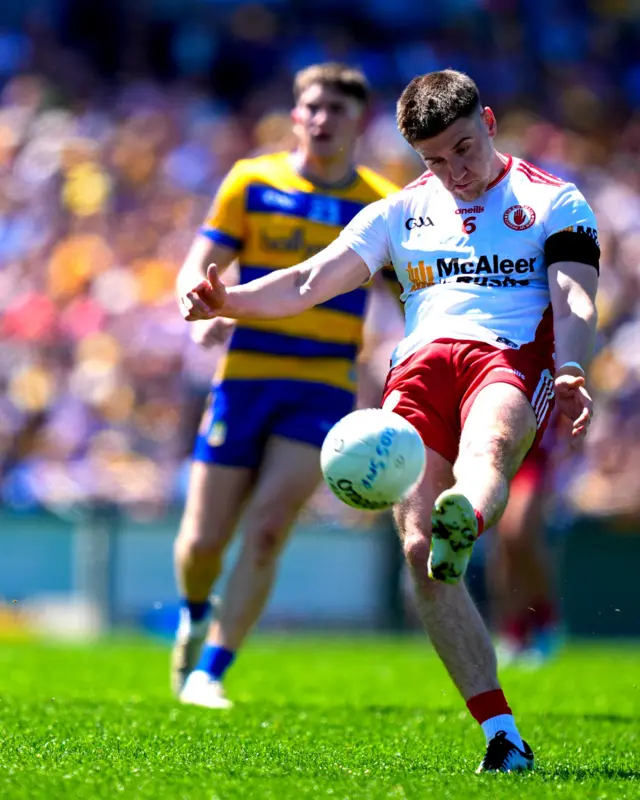 Niall Devlin of Tyrone kicking a score