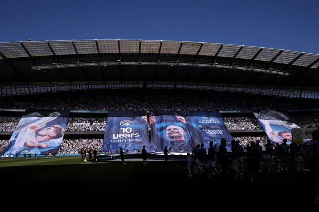 Banners in tribute to Slva, Stones, Guardiola