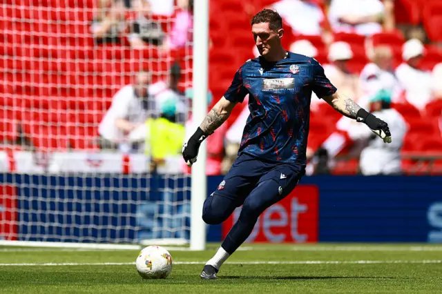 Bolton goalkeeper Jack Bonham kicks the ball in the Wembley sunshine