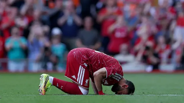 Mohamed Salah of Liverpool reacts on the pitch before being substituted off