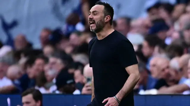 Roberto De Zerbi gestures on the touchline