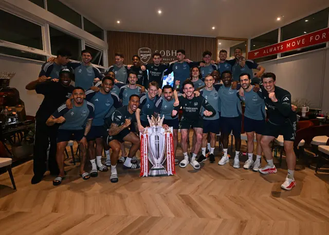 Arsenal squad with cardboard Premier League