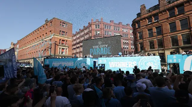 Manchester City fans during a parade in Manchester to celebrate the achievements of the Manchester City men's and women's teams this season.