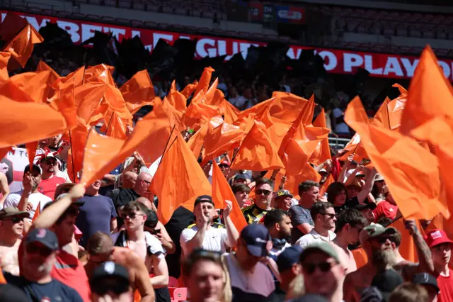 Salford City fans in the stands before the Sky Bet League Two play-off final at Wembley Stadium, London