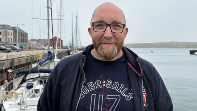 Konrad, from Stoke-on-Trent, at Lewick harbour in Shetland