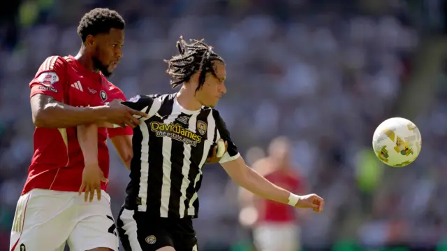 Jayden Luker of Notts County in action against Adebola Oluwo of Salford City