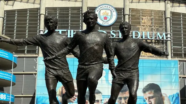 The trio of statues at the Etihad Stadium honours Manchester City legends Colin Bell, Francis Lee, and Mike Summerbeee Summerbee