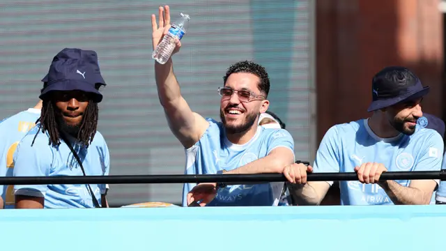Manchester City's Rayan Cherki waves to fans during the victory parade