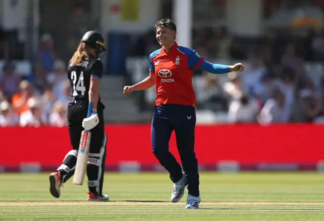 Issy Wong celebrates the wicket of Jess Kerr