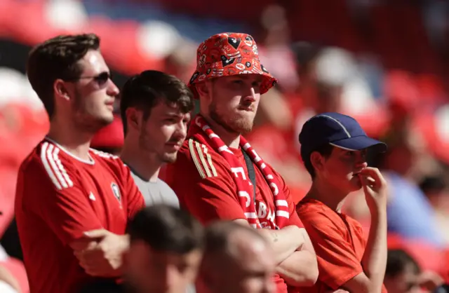 Salford City fans look dejected in the stands at Wembley