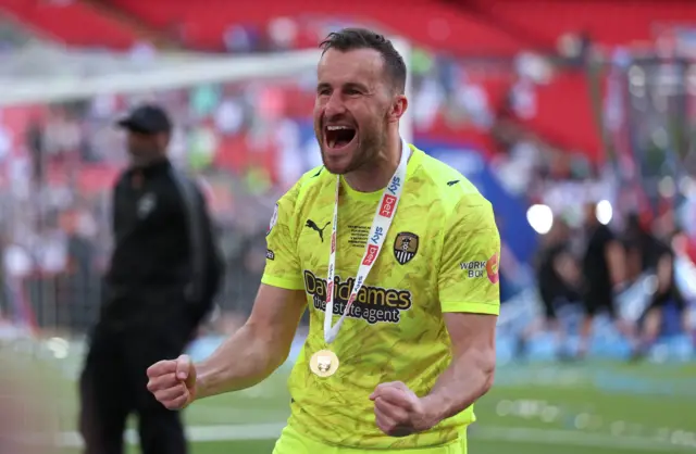 Notts County goalkeeper James Belshaw celebrates promotion after the Sky Bet League Two play-off final at Wembley Stadium, London