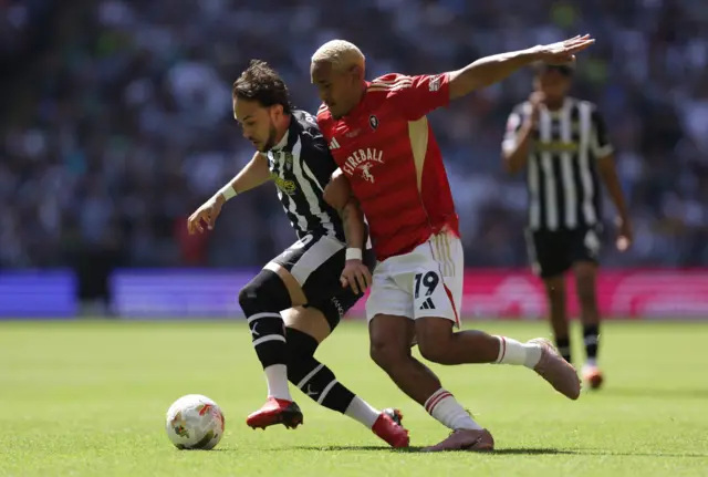 Notts County's Jodi Jones (left) and Salford City's Haji Mnoga battle for the ball during the Sky Bet League Two play-off final at Wembley Stadium, London.