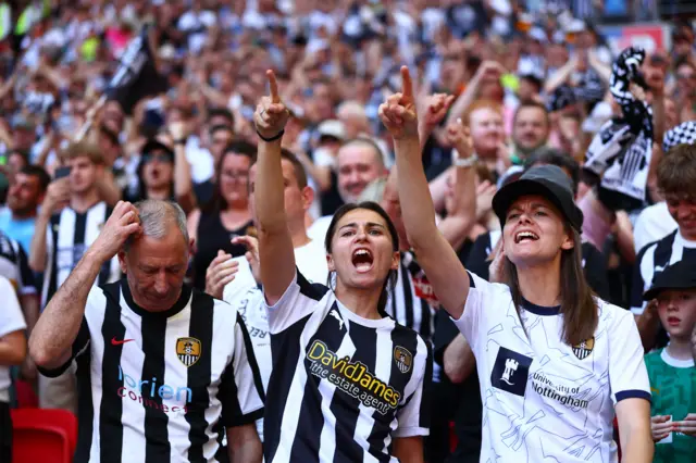 Notts County fans celebrate at half-time