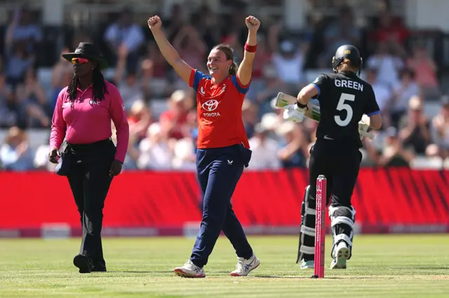 Dani Gibson celebrates the wicket of Maddy Green