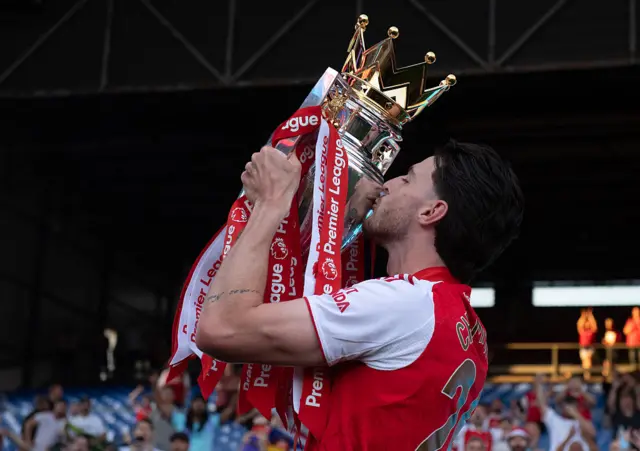 Arsenal captain Declan Rice with the Premier League trophy