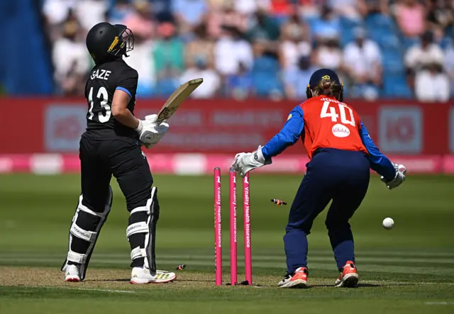 Izzy Gaze is bowled by Charlie Dean