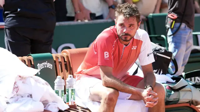 Stan Wawrinka sits down after his first-round loss