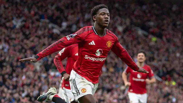 Kobbie Mainoo of Manchester United celebrates scoring the third goal during the Premier League match between Manchester United and Liverpool at Old Trafford.