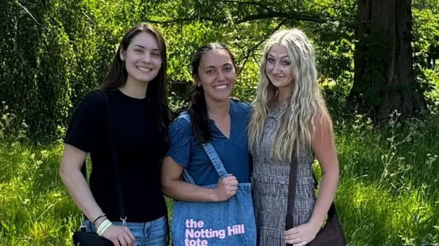 Alyssa McCave, 19, Jayda Masina, 23, and Autumn Cook, 21, three women from the United States, pose for a photograph in Regent's Park, London