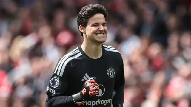 Manchester United goalkeeper Senne Lammens celebrates a goal during the Premier League match between Manchester United and Nottingham Forest at Old Trafford.