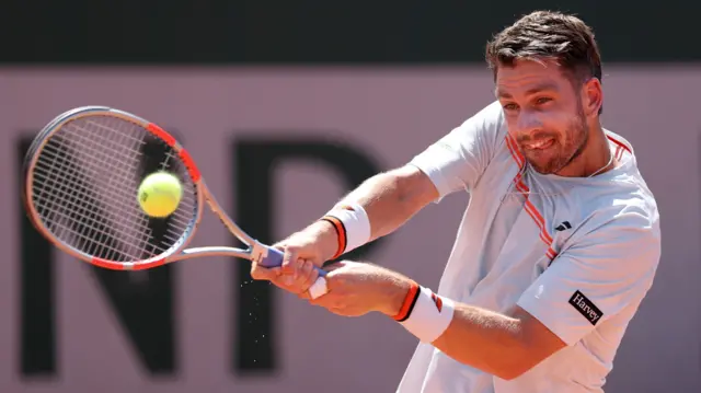 Cameron Norrie hits a backhand