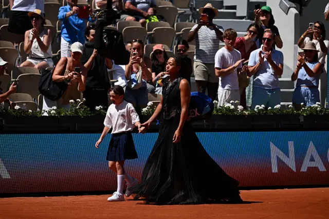 Naomi Osaka walks onto court