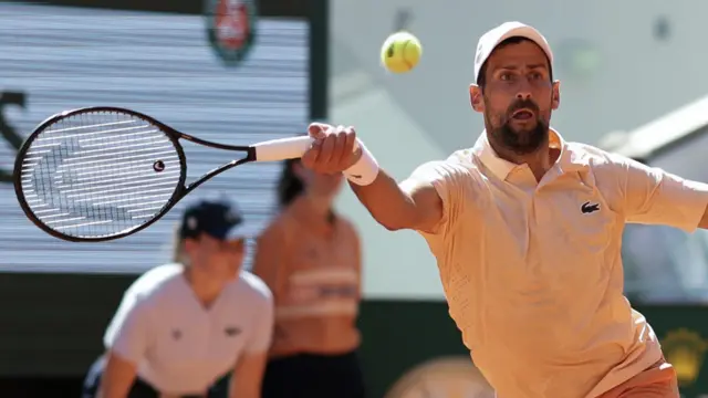 Novak Djokovic hits a forehand