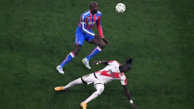 Pathe Ciss is challenged by Jean-Philippe Mateta