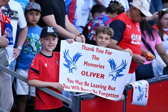 Crystal Palace fans with a sign for Oliver Glasner