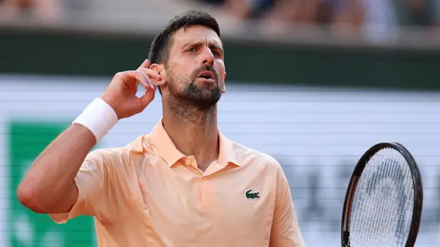 Djokovic gesturing to the crowd