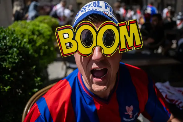 Crystal Palace fan with 'BOOM' on glasses
