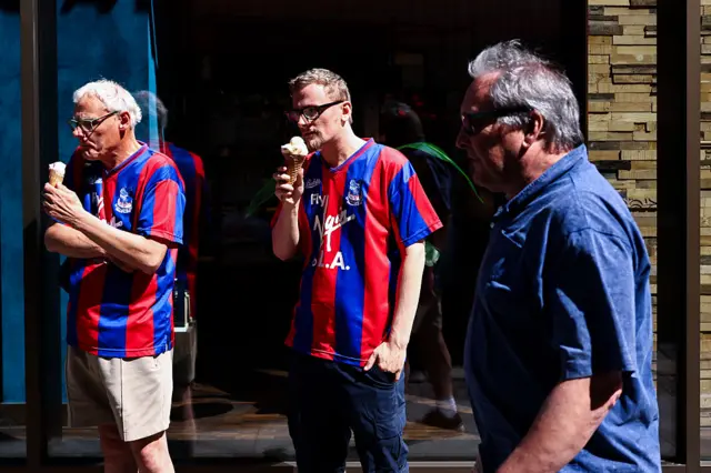 Crystal Palace fans eating an ice cream