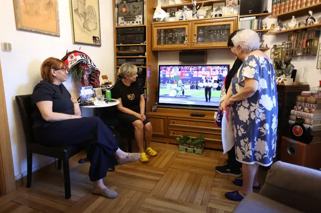 A family of Rayo Vallecano fans watch the final in their home