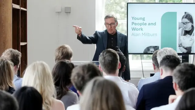 Alan Milburn speaking to the press at an event in North London