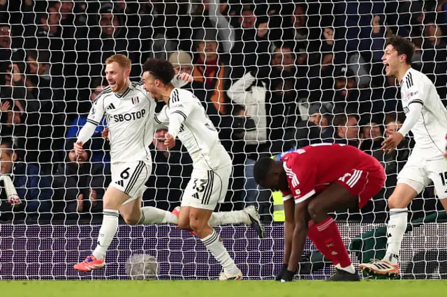 Harrison Reed of Fulham celebrates with Antonee Robinson after he scored for 2-2