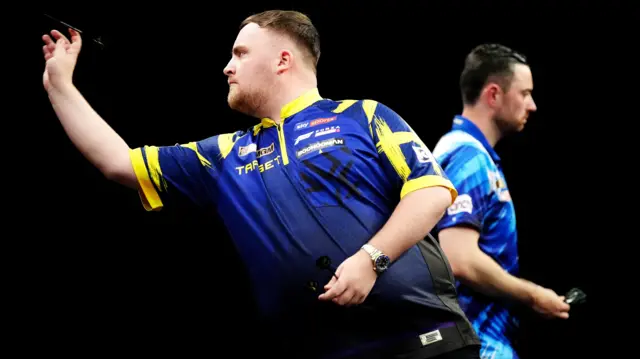 Luke Littler (left) during the final against Luke Humphries on finals night of the 2026 BetMGM Premier League at The O2 in London