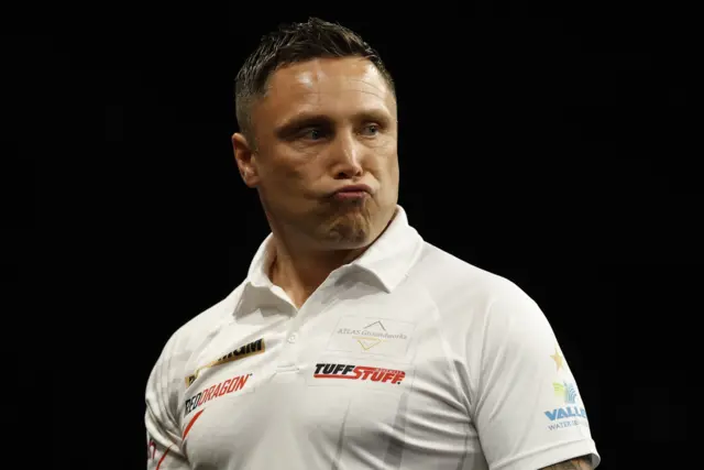 Gerwyn Price reacts during his semi final match against Luke Littler