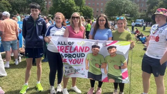 A group of supporters holding a flag that says all of ireland is so proud of you