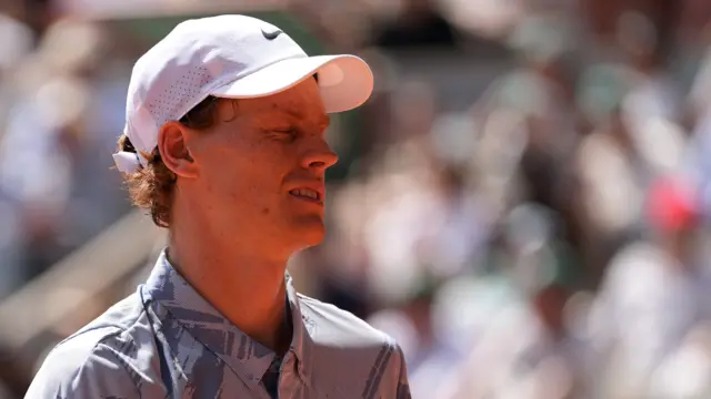 Jannik Sinner grimaces