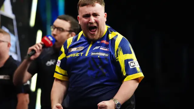 Luke Littler celebrates winning his semi-final against Gerwyn Price on finals night of the 2026 BetMGM Premier League at The O2 in London
