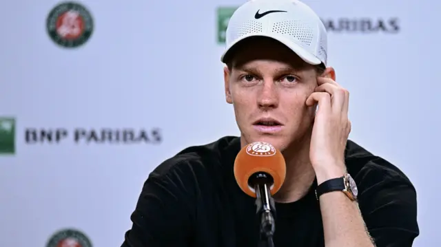 Jannik Sinner speaks at a press conference
