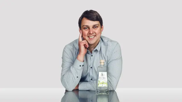 Scott Wilson-Laing poses with bottle