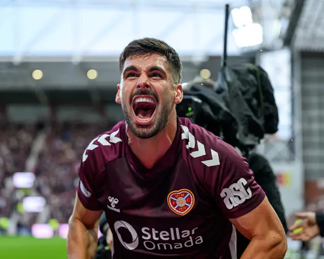 Claudio Braga of Hearts celebrates after Hearts scored